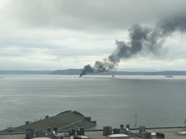 Boat on fire in middle of Puget sound, looks like they just letting it burn until it sinks.