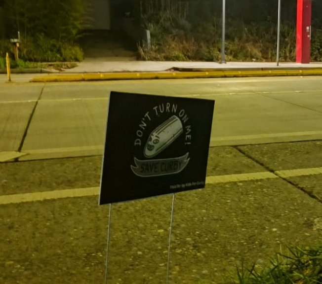 Wondering who’s behind those ‘Save Curby’ signs on Delridge?