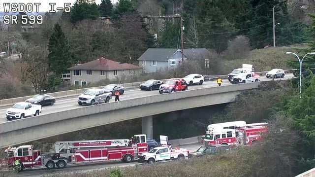 Fatal crash on overpass causes vehicle to fall onto I-5 near Seattle, blocking most lanes