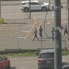 Cops with rifles in International district, pointed at some guy