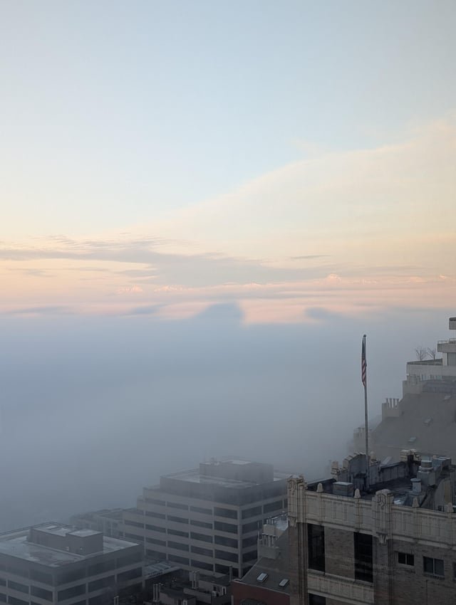 Seattle’s Silhouette: Skyline Shadows Drape the Puget Sound Fog