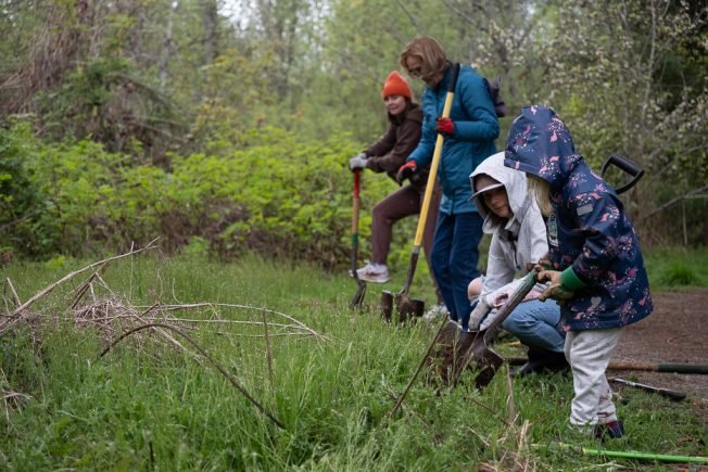 PHOTOS: As DNDA volunteers dig in for Earth Day, a legend rejoins them