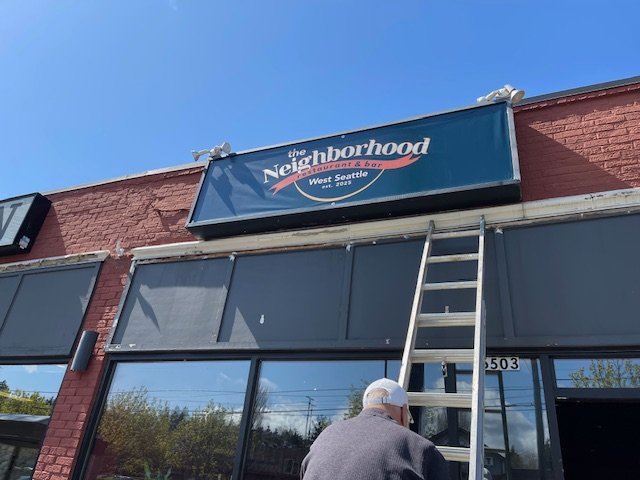 BIZNOTE FOLLOWUP: Sign goes up as new restaurant The Neighborhood prepares to open