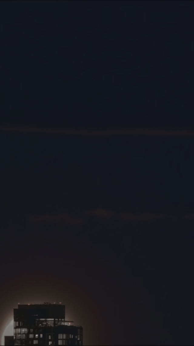 A timelapse of the moon rising behind the Space Needle