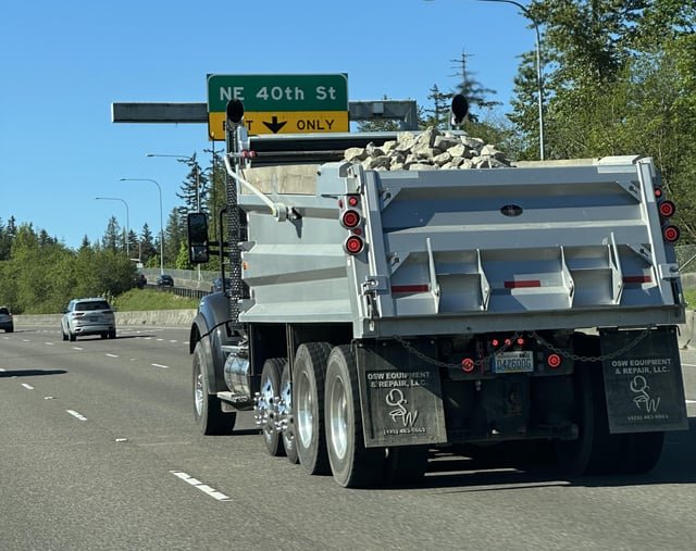 Where to report such dumb drivers? Is it so hard to cover stones? P.S. I replaced two windshields because of these idiots…