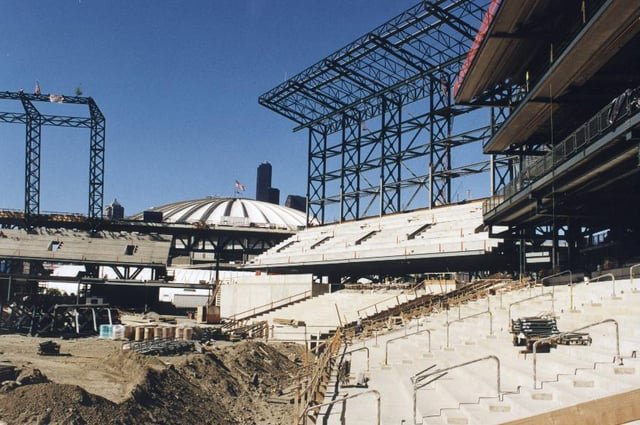 The Kingdome looms out in left field from the still-under construction Safeco Field. 1998.