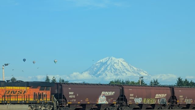Caught these balloons passing Mt Rainier today