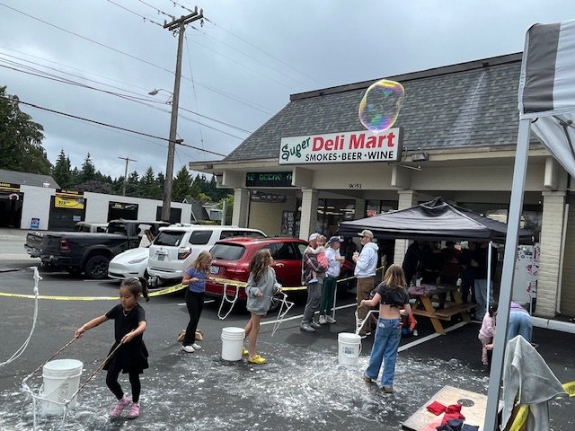 HAPPENING NOW: Mini-block party at Super Deli Mart benefiting Fauntleroy Fall Festival