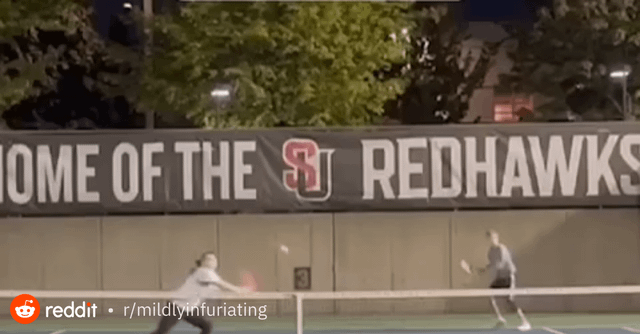 Woman gets angry about being hit by a tennis ball while playing tennis