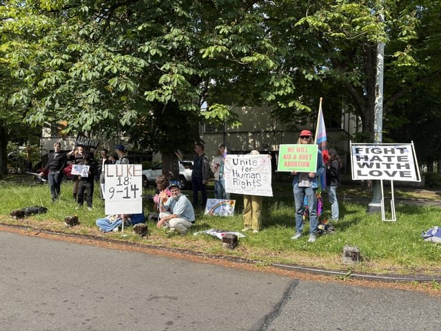 counter-protest gathered now across from Pursuit Church in University District