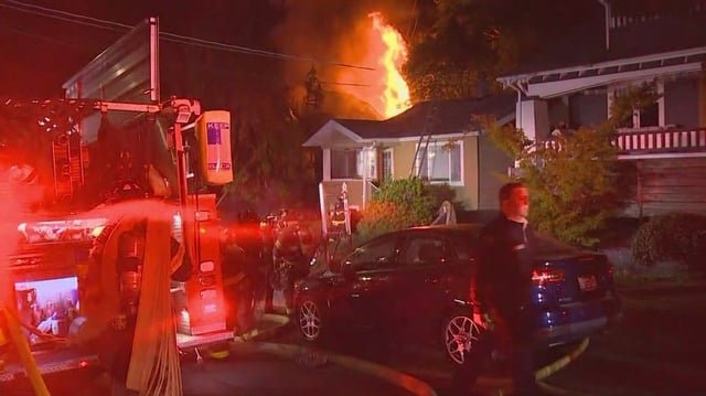 Woman in critical condition after she was rescued from Seattle house fire