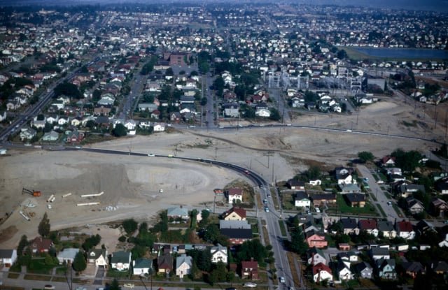 Land clearing for I-5 near Green Lake, north Seattle, 1963. Roosevelt Reservoir sits upper right, at center left is intersection of NE 80th Street and a temporary road that connect to NE 77th Street near Latona Ave NE.