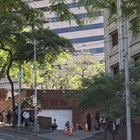 People in masks around federal building on 1st Ave
