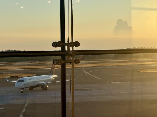 Waiting at SeaTac, I believe Pyrocumulus cloud over the Olympic Mountains. Bear Gulch or Hamma Fire? Incredibly unusual, maybe unprecedented, if I’m right