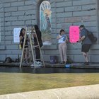 Councilmember Hollingsworth and Councilmember Rinck have joined a community member to clean off the Hot Rat Summer Mosaic.