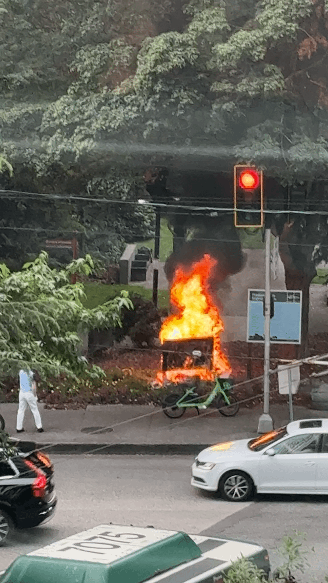 Some homeless person just set the freeway park sign on fire