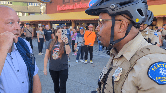 Waterfront ESU officers shut down street magician during Grand Opening of new pier. Public gets involved and situation escalates.