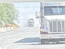 Eastbound I-90, flaming tractor trailer of hay