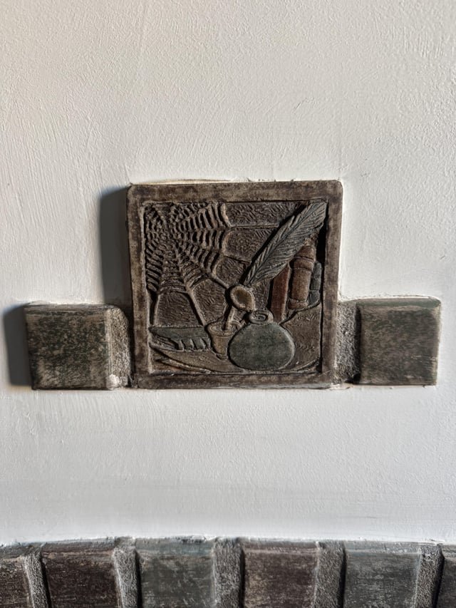 Help us understand tile above fireplace in 1927 Seattle home?