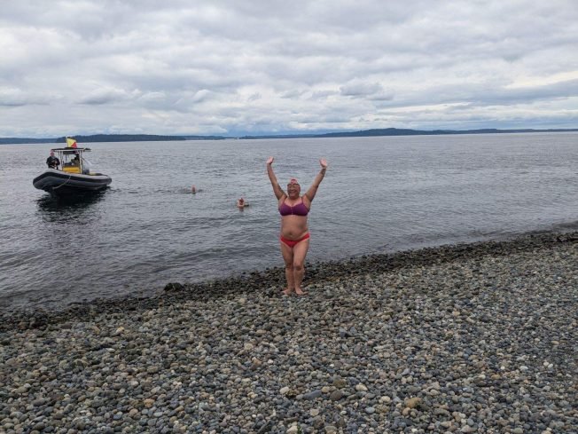 IN THE WATER: Two Alki regulars about to take on major marathon swims