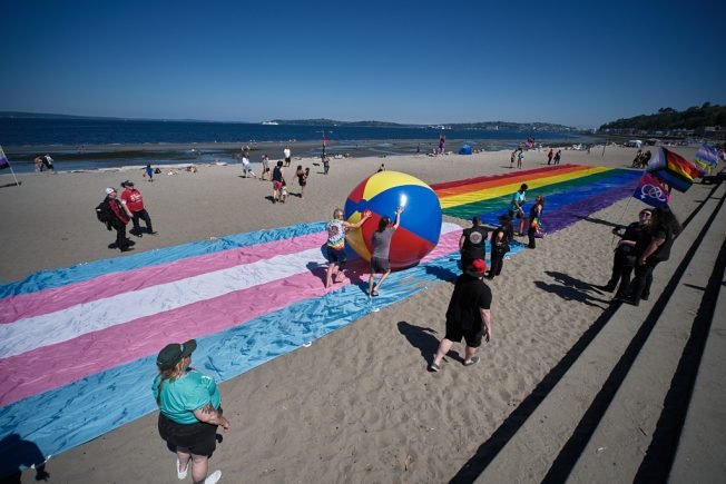 ‘Being seen for more than just June’: Alki Beach Pride’s annual flag ceremony, with motorcycles, six days before main event