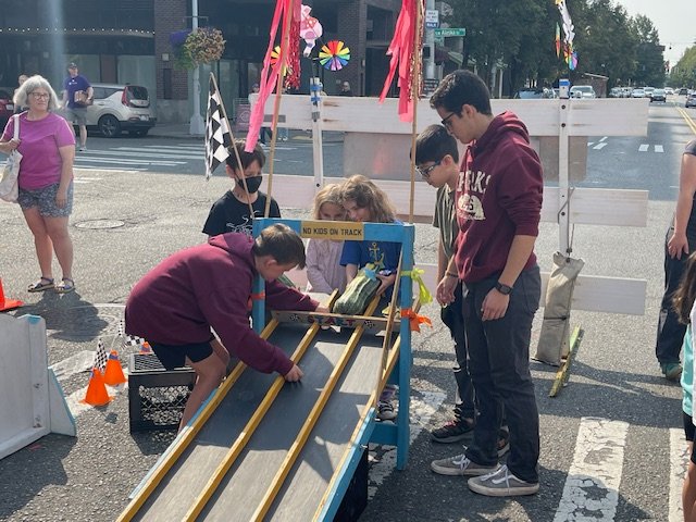 HAPPENING NOW: It’s on! This year’s zucchini racing at West Seattle Farmers’ Market