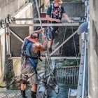 Muckleshoot Tribal Fishing at Ballard Locks this afternoon. Man standing on bow of boat is booming the water to scare off Harbor Seals: