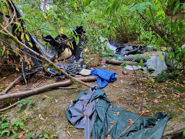 Where to report abandoned homeless camp in arboretum?