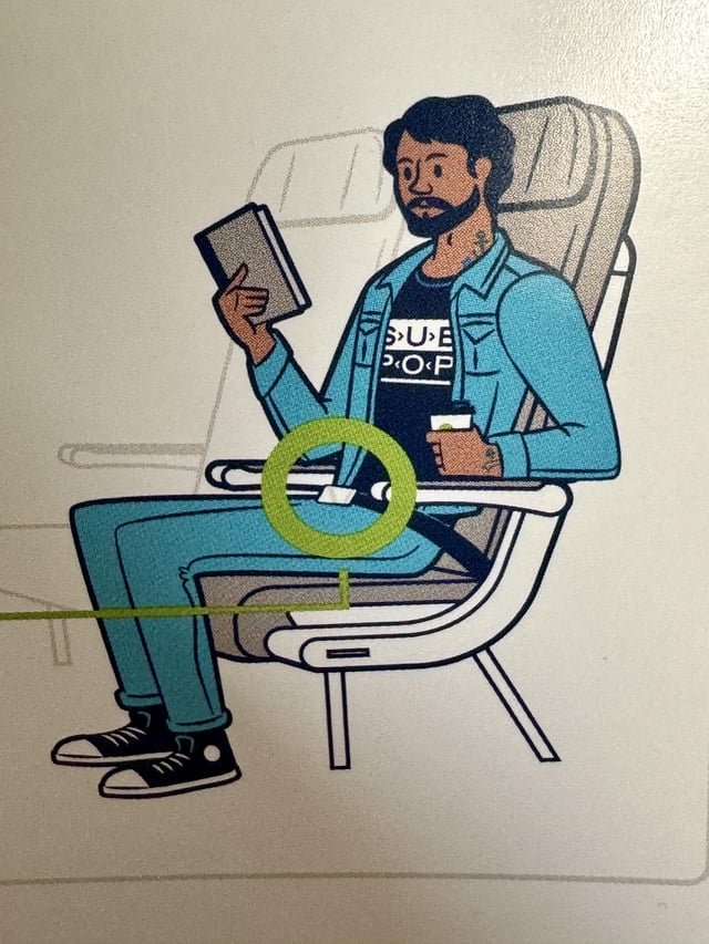 Alaska Air safety card guy wearing sub-pop t-shirt.
