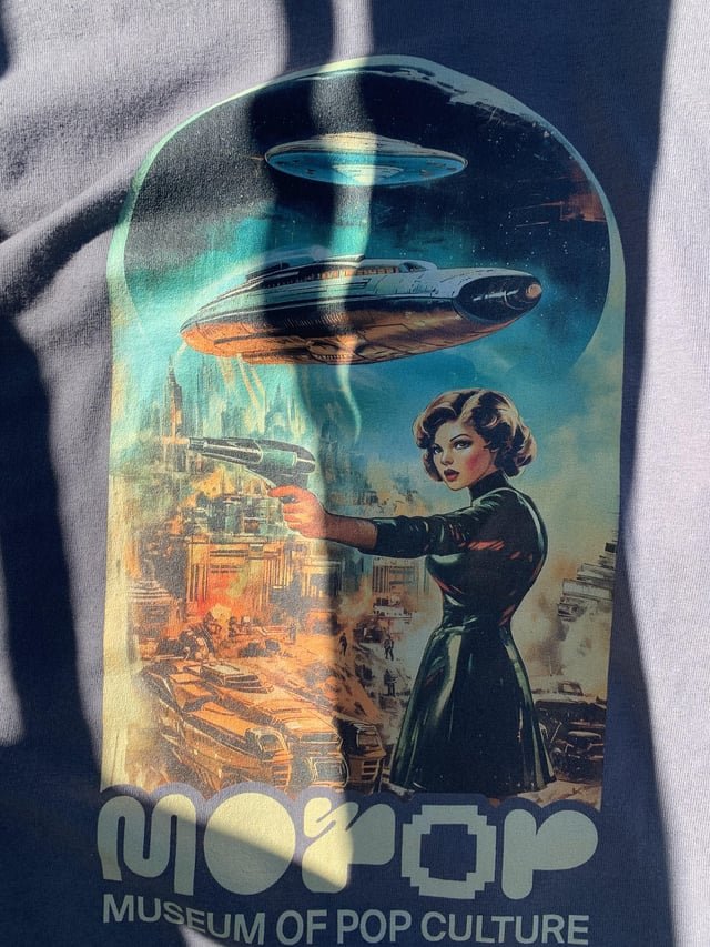 Just bought this shirt from the museum of pop culture. Is it AI or am I tripping?????