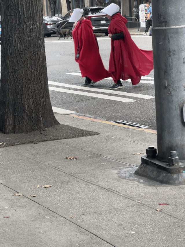 Something about seeing women in Handmaid’s Tale costumes out on the street feels a little eerie.