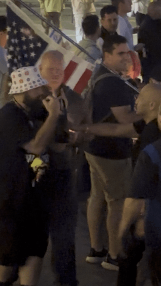 At Charlie Kirk vigil organized by Pursuit Church, protester gets punched after walking through crowd flipping the bird with both hands