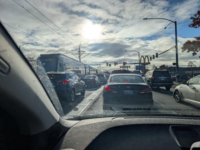 Light rail stuck in the middle of Graham St intersection headed south