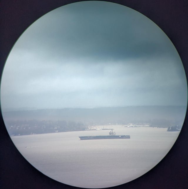 USS Nimitz passing in front of Bainbridge (view from Columbia Tower)