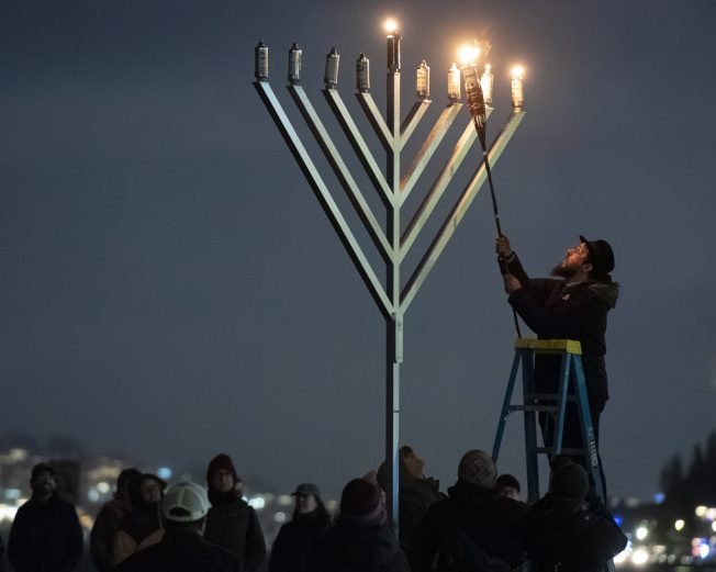 HANUKKAH: West Seattle Torah Learning Center lights giant menorah at Alki