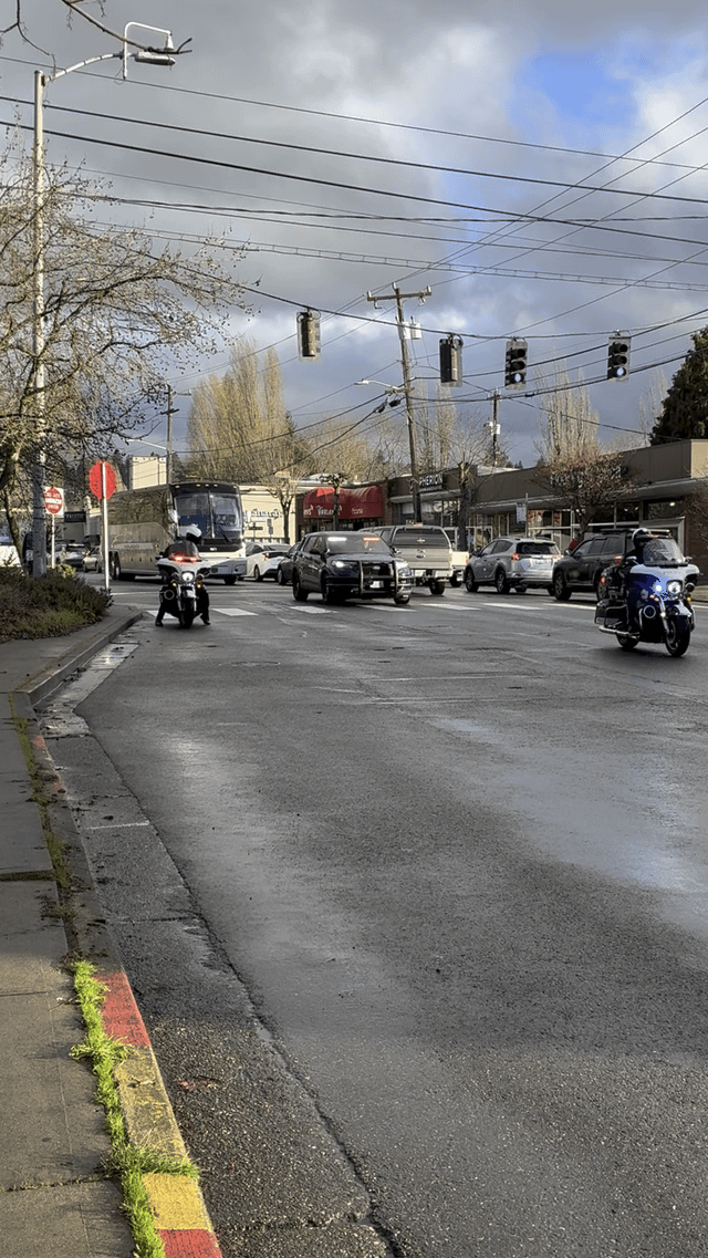 Police escort of charter buses on Sand Point Way