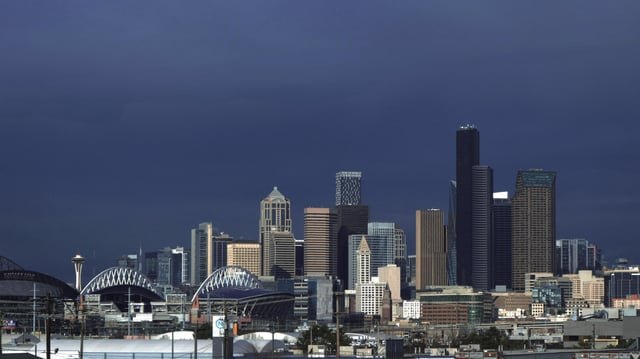 The storm looms behind downtown
