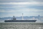 USS Nimitz passing Seattle for the second-to-last time ever (in an total squall gfdi)