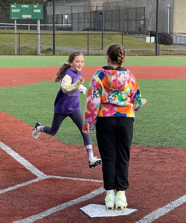 West Seattle High School softball players step up to the plate with another mentoring clinic this year