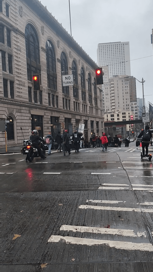 Marching in the rain through Belltown, Seattle