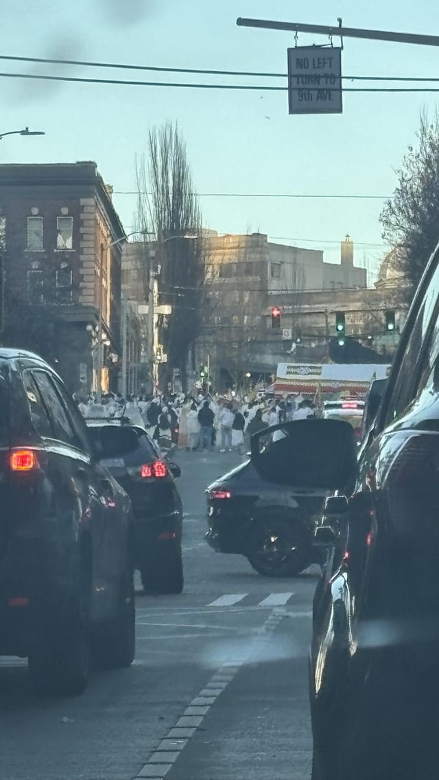 Anyone know what was going on in pike street today? It looked like a specific community in white garbs doing a march on pike from downtown to cap hill. Whole families joining in.