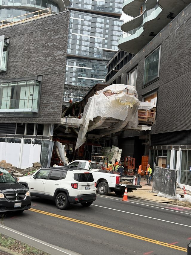 Boeing 747 fuselage installing between two towers