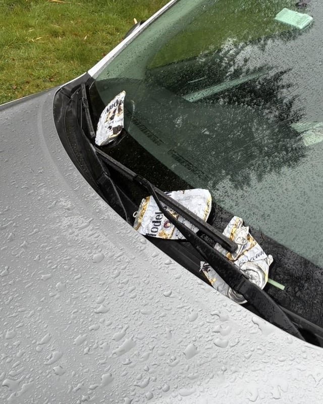 Someone put cans under my wipers, why?