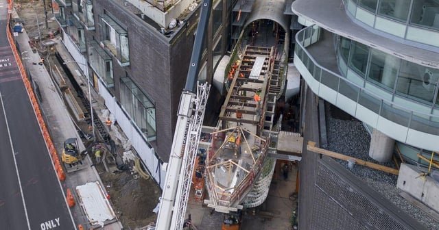 In nod to Boeing, a jumbo fuselage hangs between two Seattle towers