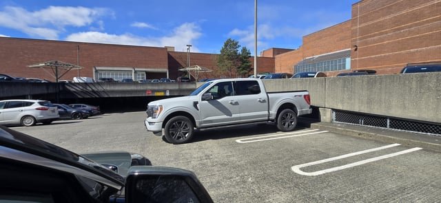 Huge truck in compact parking spot