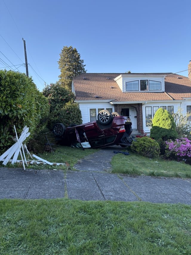Car flipped on a lawn