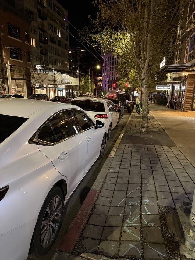 5 cars parked in bus stop