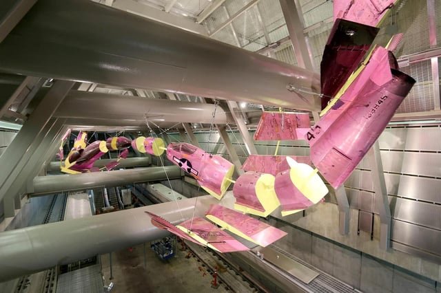 TIL The fighter jets suspended from the ceiling in Capitol Hill Station are real U.S. Navy A4 Skyhawks that were decommissioned, sliced up, and painted.