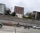 Teens on e-bikes on I5 UW to International District