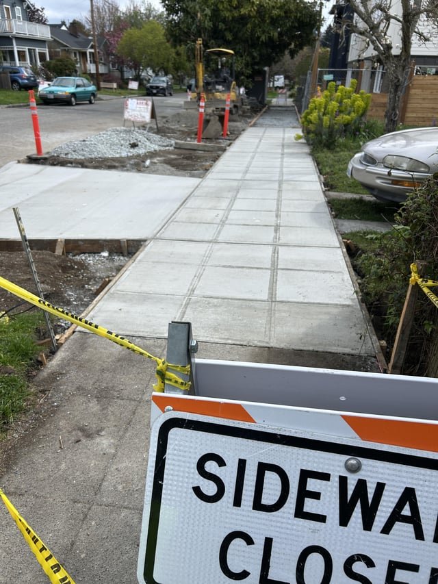 Who replaces the sidewalk?